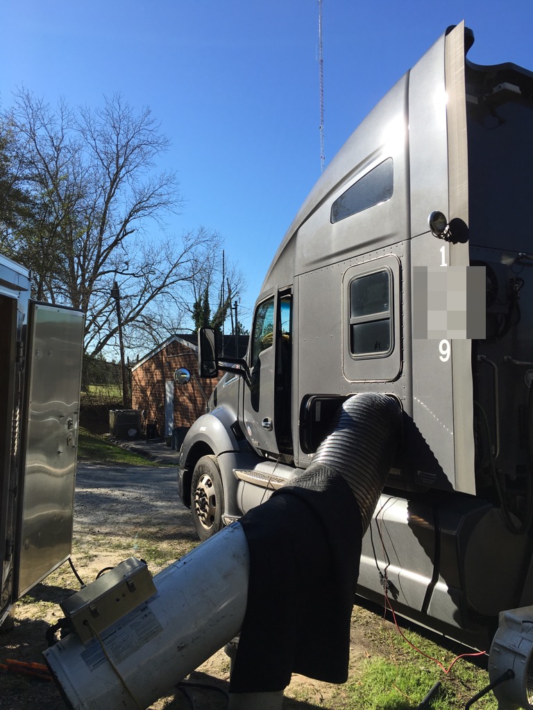 a tractor trailer being bed bug treated
