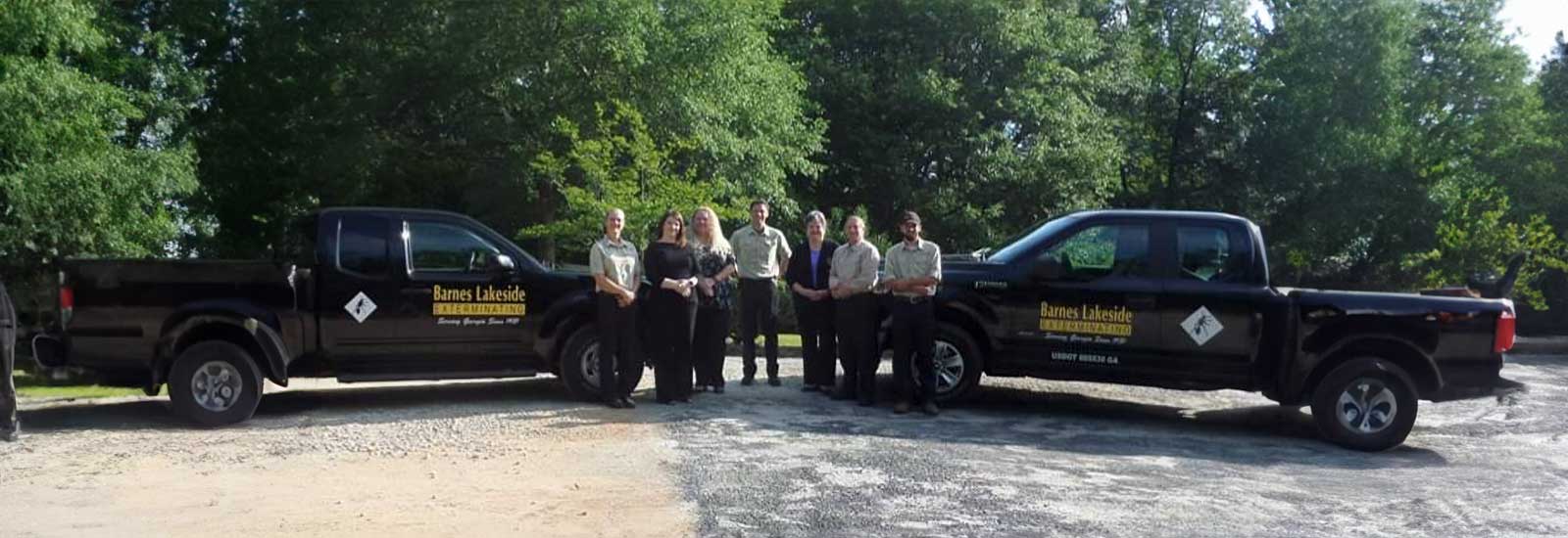 The Barnes Lakeside team and two of their company trucks